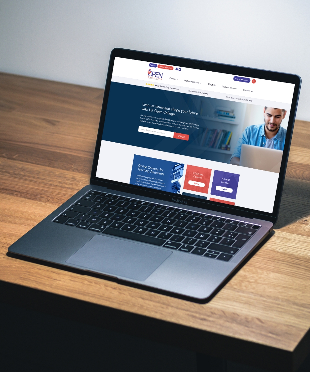UK Open College Website displayed on a Macbook Pro